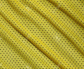 Texture of sportswear made of polyester fiber. Outerwear for sports training has a mesh texture of stretchable nylon fabric